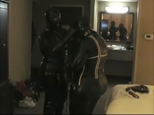 Two rubber girls get their gas masks on.