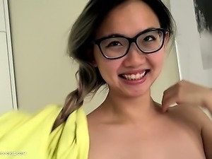 Nerdy asian teen with big tits does oil show