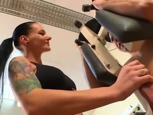 Busty raven haired fitness slut sucks her trainer off in the gym