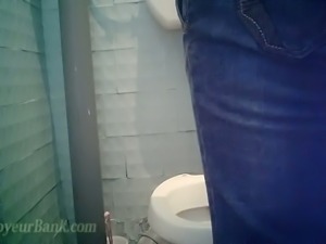 White amateur lady in blue jeans exposed on cam in the toilet
