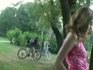 Marvelous skinny white girl in pink dress flashes her petite booty in the park