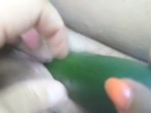 Cucumber in a spongy pussy.