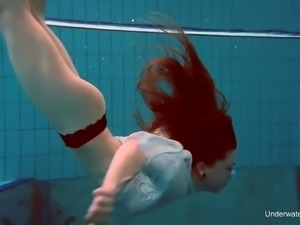 Nice chick Katrin Bulbul swims and flashes her pierced hard nipples