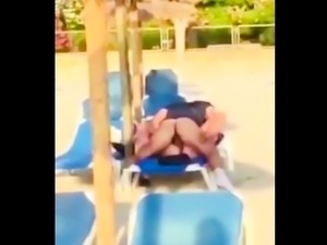 Beach voyeur films a horny couple enjoying wild sex action