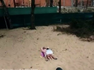 Beach voyeur filming brunette teen riding boyfriend's cock